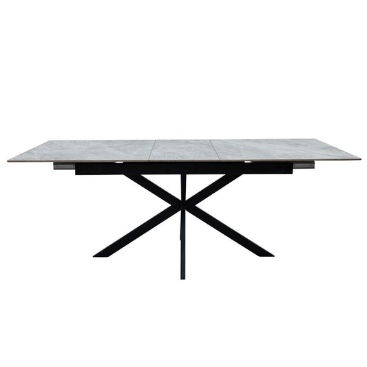 Rectangular table with a tiled top and black metal frame on a white background