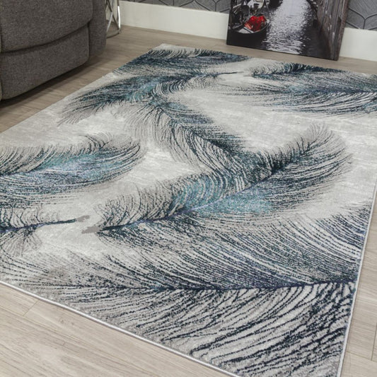 Abstract patterned rug on a wooden floor with a gray sofa in the background
