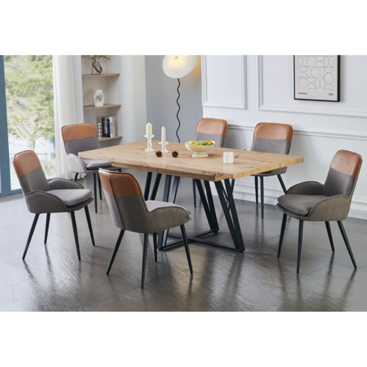 Dining room with a wooden table and chairs in a modern interior setting.