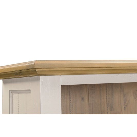 Wooden cornice on a white wall with wooden paneling