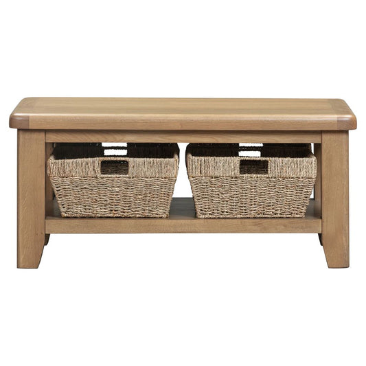 Wooden coffee table with two woven basket storage compartments on a white background