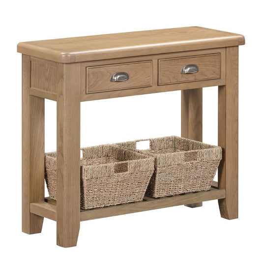 Wooden console table with two drawers and two wicker baskets on a white background