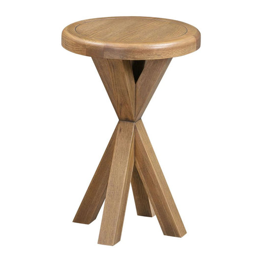 Wooden table with a round top and four legs on a white background