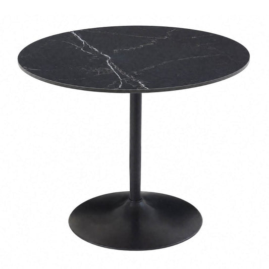 A round black sintered stone top table with a black pedestal base.
