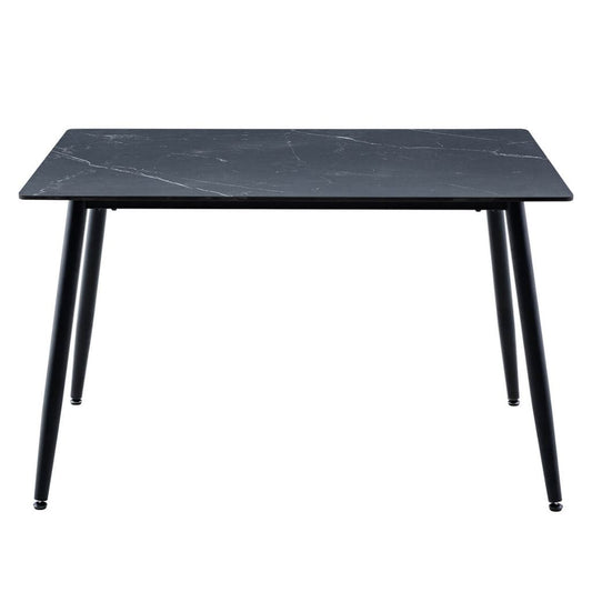 A modern rectangular dining table with a black sintered stone top and four tapered black metal legs.