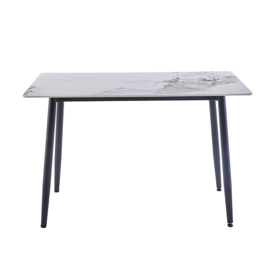 A rectangular dining table with a white sintered stone top and four black metal legs.
