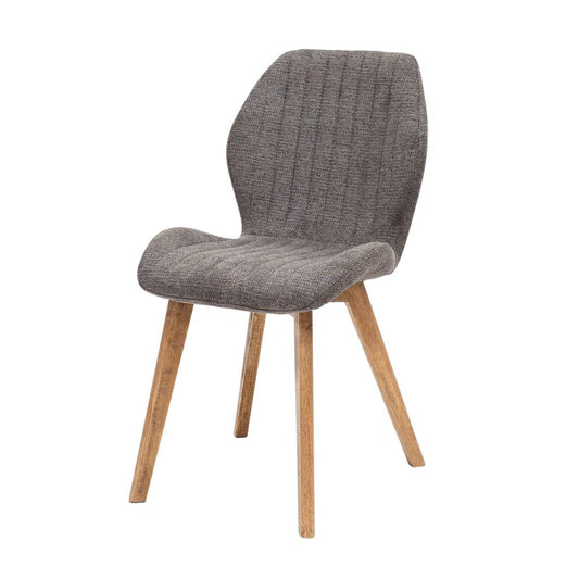 Grey upholstered chair with wooden legs on a white background