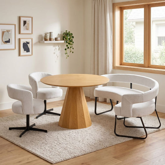 A contemporary dining set with curved bench 2 matching chairs around a wooden pedestal based table.