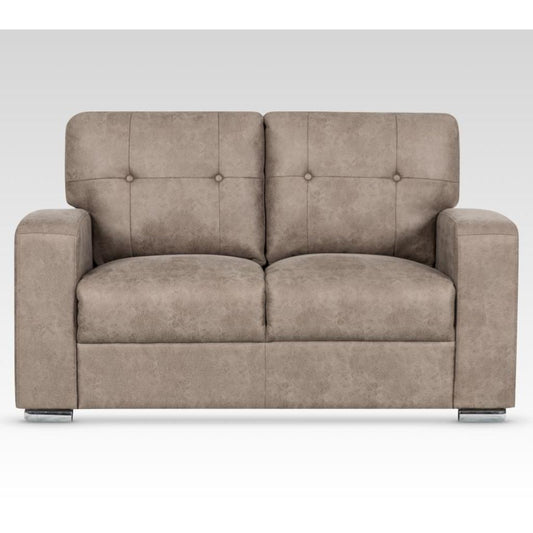 Beige sofa with buttoned backrest on a white background