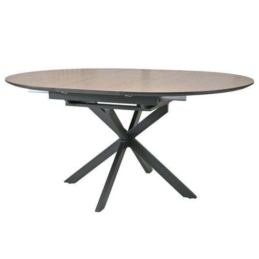 Round dining table with a oak top and black metal base on a white background