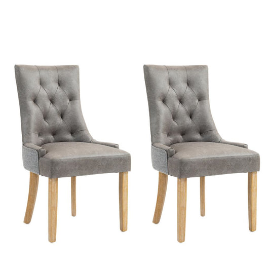 Pair of grey faux leather dining chairs