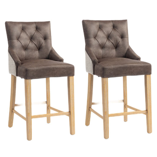 Two matching bar stools with tufted nutmeg backs, light wood legs, and natural chenille fabric side panels.