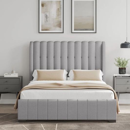Grey upholstered bed with matching headboard in a bedroom setting.