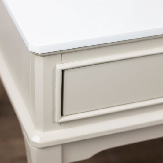 Close-up of stone coffee table with a white top