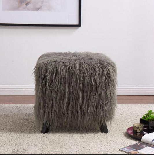 Fluffy grey ottoman with black legs