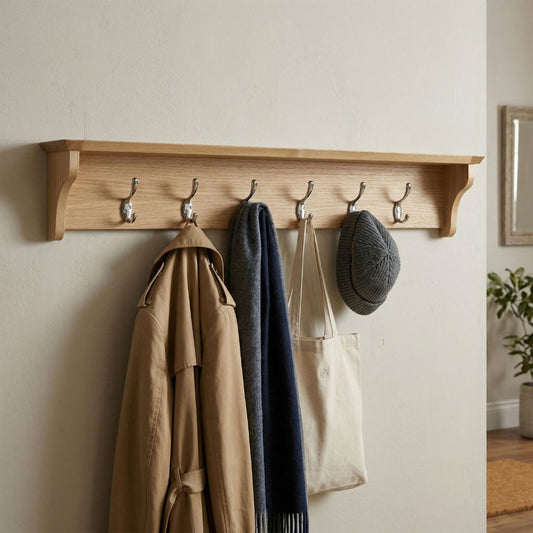 A light natural wood wall-mounted coat rack with six hooks, perfect for big families and guest.