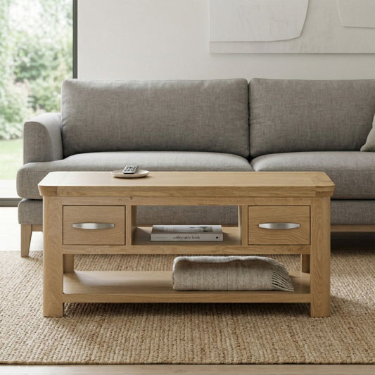 A light oak wood coffee table with two drawers and an open lower shelf.
