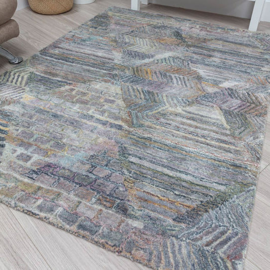 Multicolored patterned rug on a wooden floor