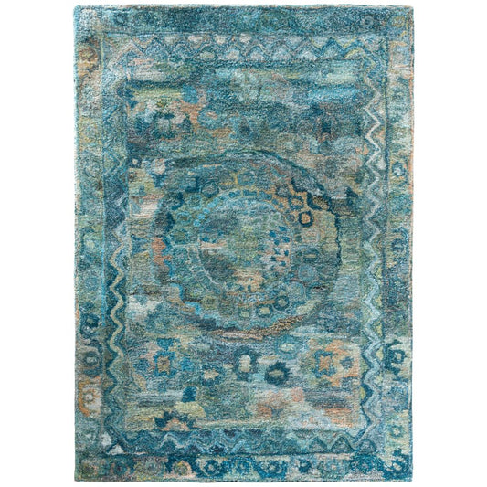 Decorative rug with intricate patterns in blue and beige on a white background
