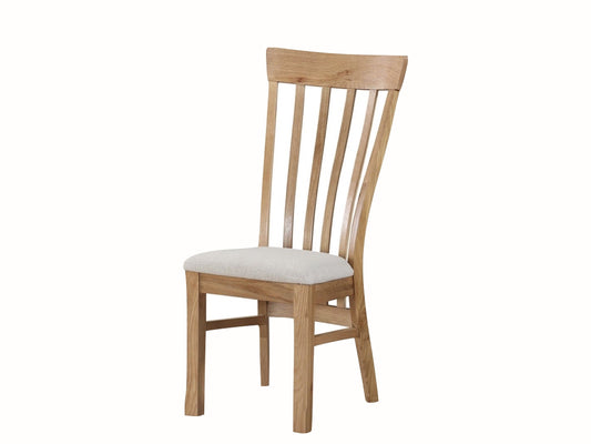 A traditional rustic oak dining chair with a white cushion, part of the Kilmore Oak Range.