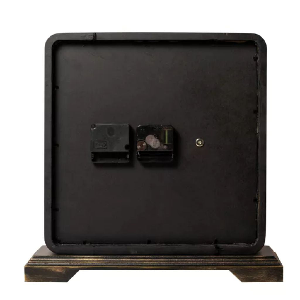 Black metal clock with a wooden base on a white background