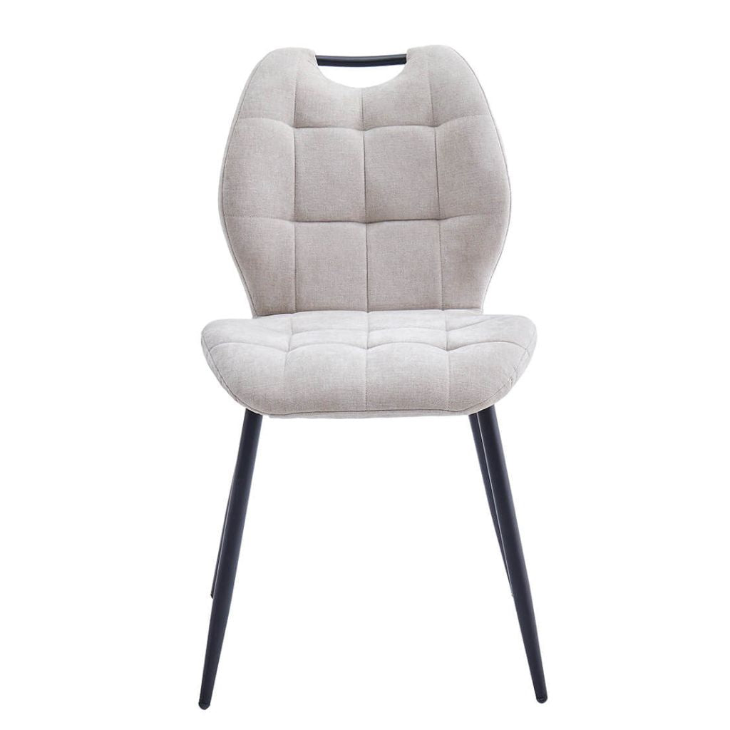 Beige fabric upholstered dining chair with black legs