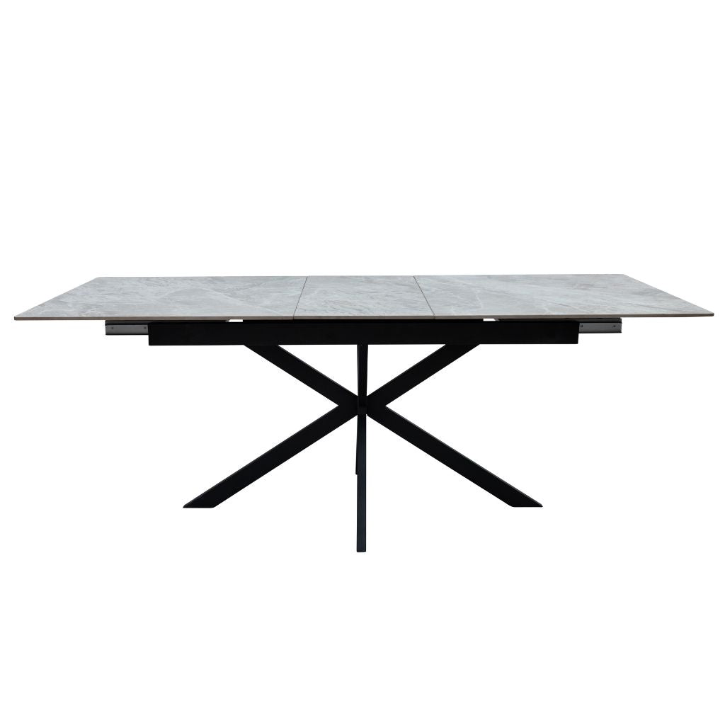 Rectangular table with a tiled top and black metal frame on a white background