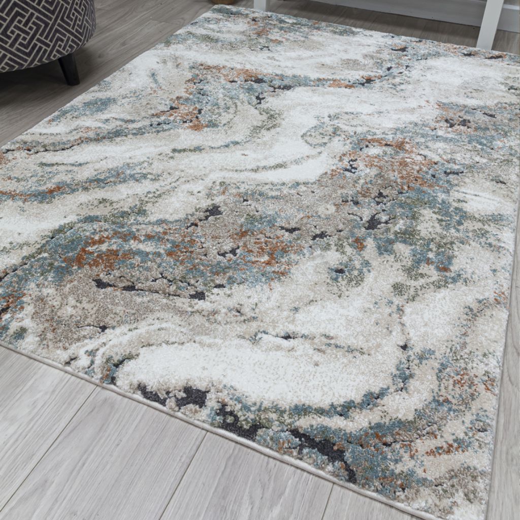 Decorative area rug with a marble-like pattern on a wooden floor.