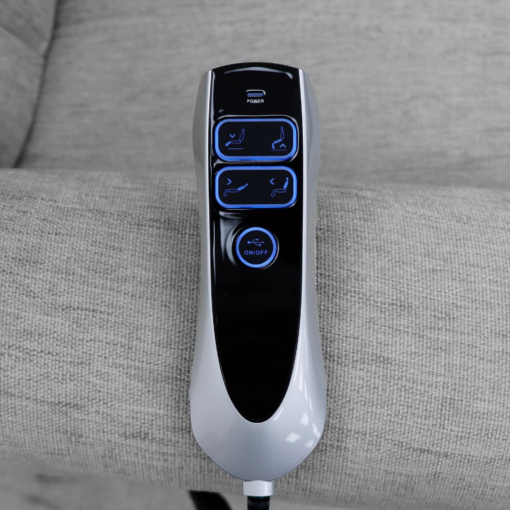 Remote control device with blue buttons on a gray fabric surface