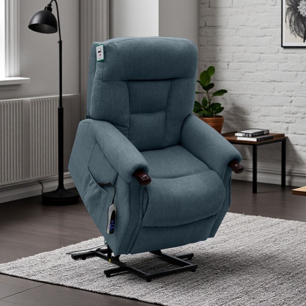 Blue recliner chair in a living room setting with a lamp and plant in the background.