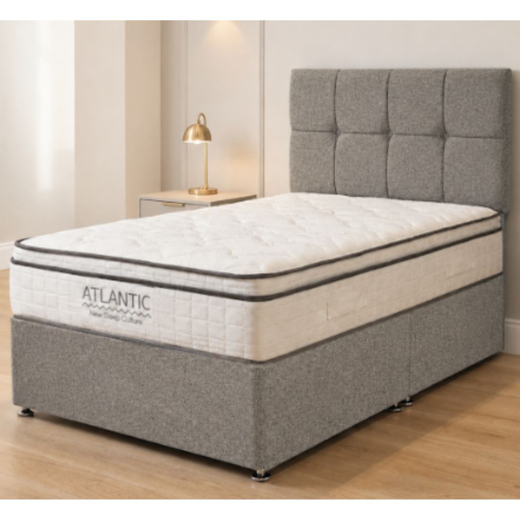 An Atlantic brand 1000 pocket sprung mattress on a grey upholstered base and headboard.