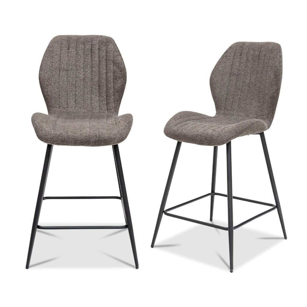 Two gray bar stools with black metal legs on a white background