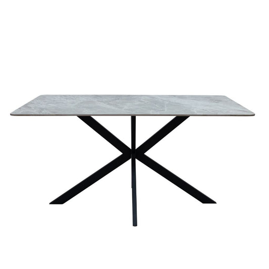 Dining table with marble-like top and black metal legs on a white background