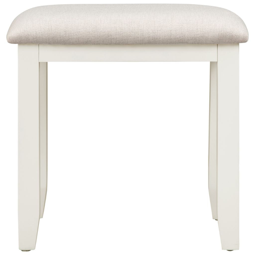 Ivory stool with a beige cushioned top on a white background