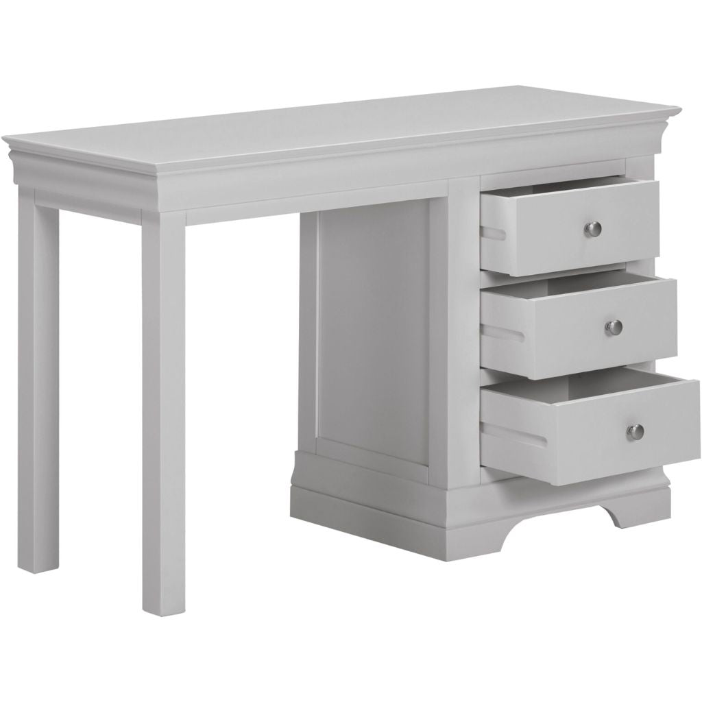 Grey desk with three drawers on a white background