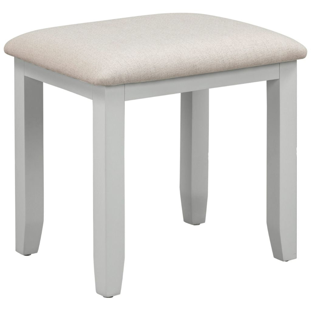 Grey stool with a beige cushioned top on a white background