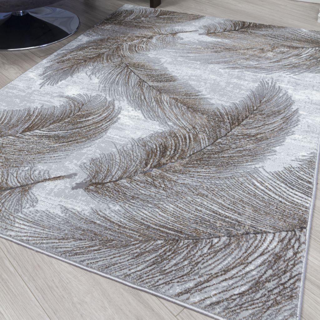 grey rug with a feather pattern