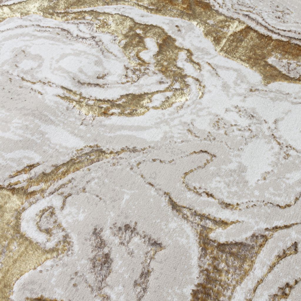 Close-up of a marble-like surface with gold and white patterns
