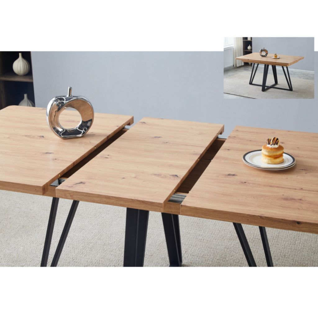 Wooden dining table with black metal legs, shown in a room setting.