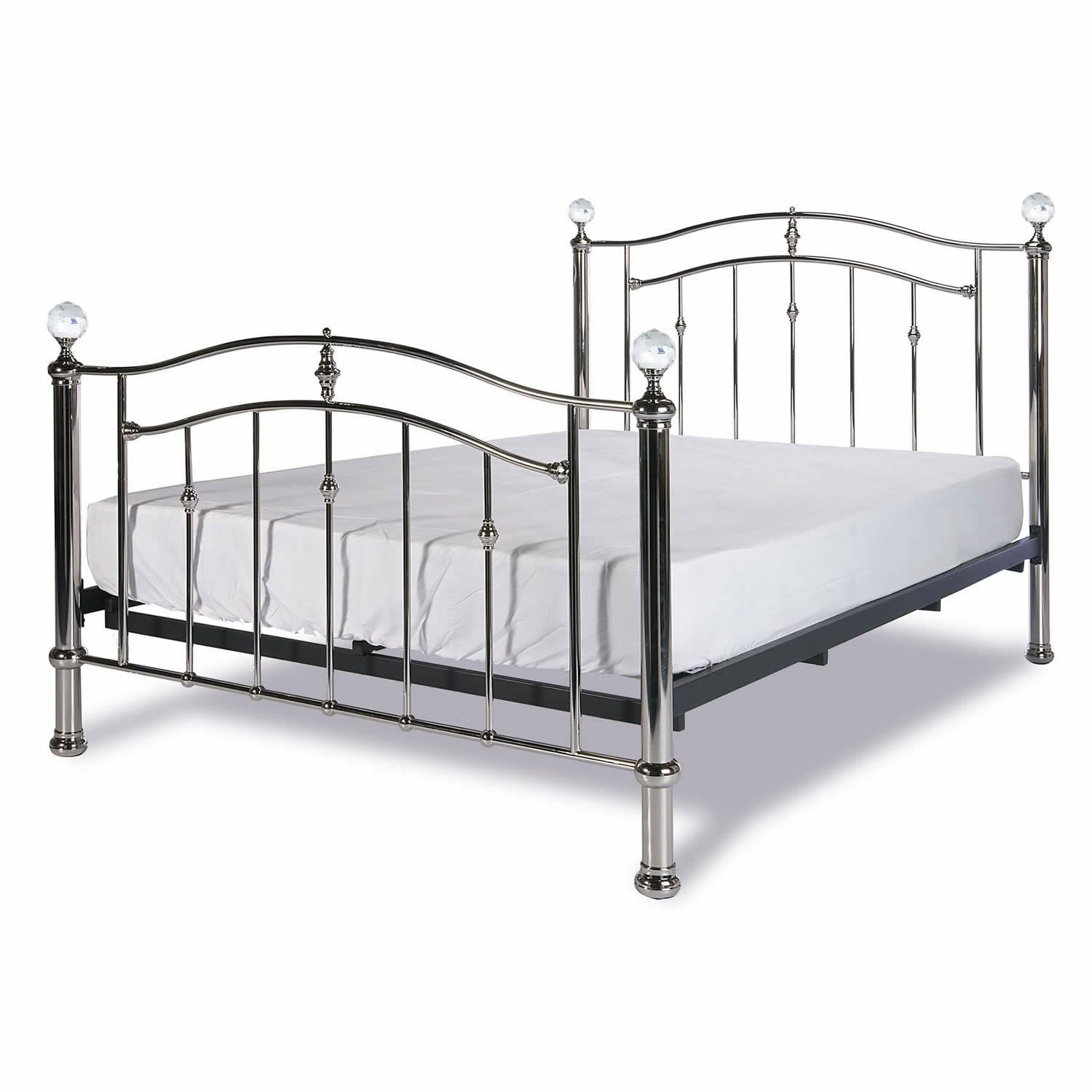 Metal bed frame with headboard and footboard featuring crystal finials