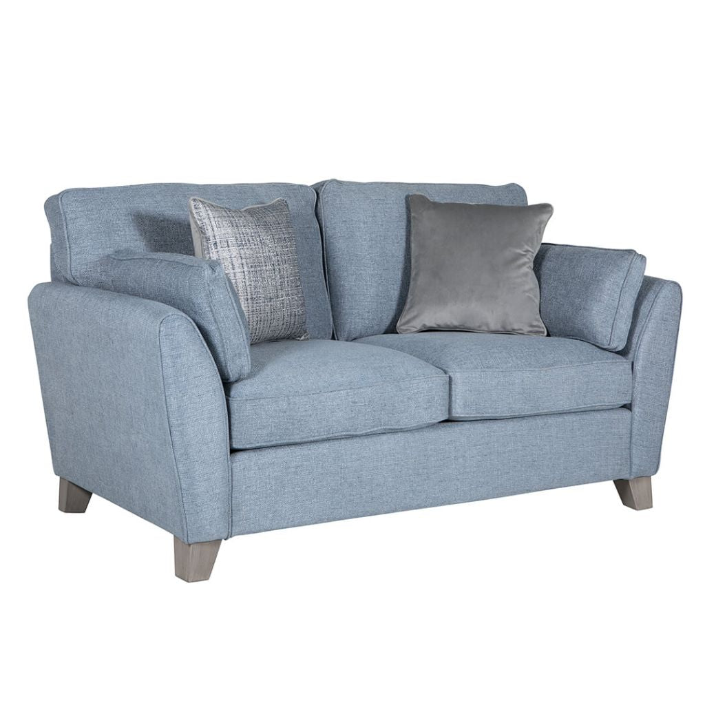 Blue sofa with gray cushions on a white background