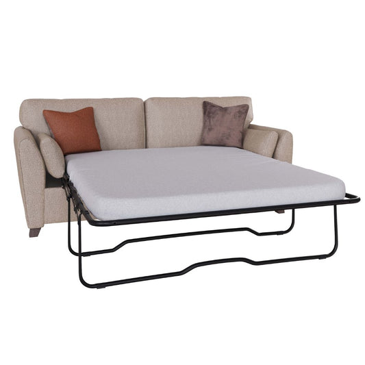 A beige upholstered sofa which pulls out into the perfect sofa bed for guests.