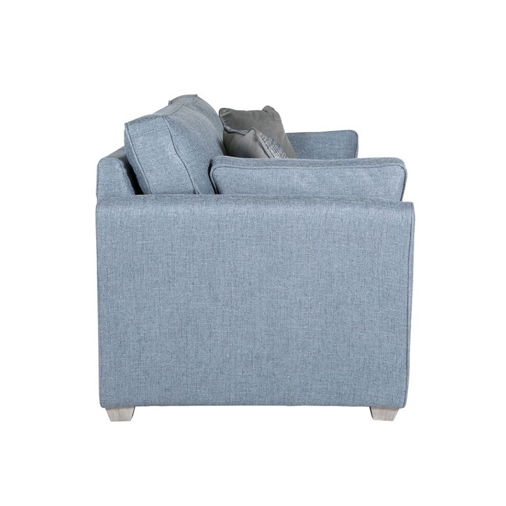 Side view of the cantrell sofa bed featuring the limed oak finish wooden legs 