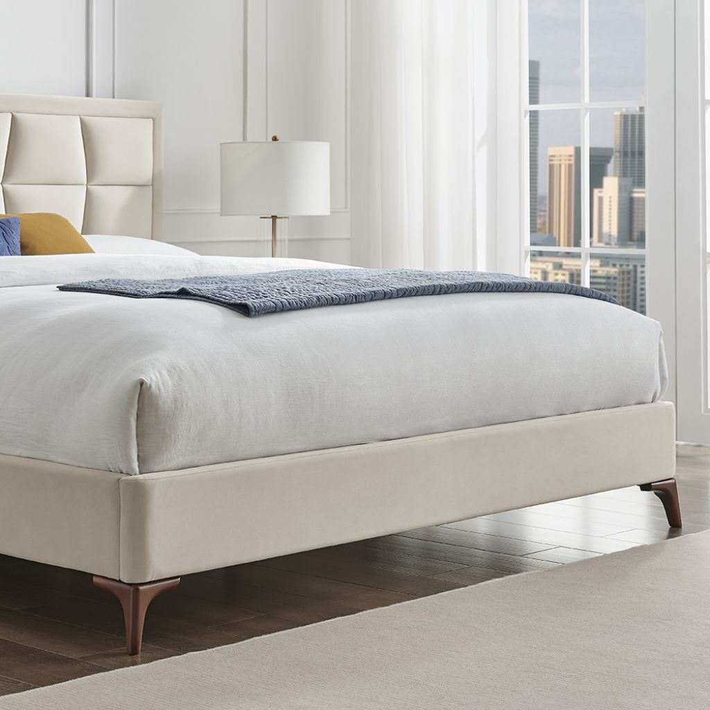 Modern bedroom with a bed, lamp, and city view