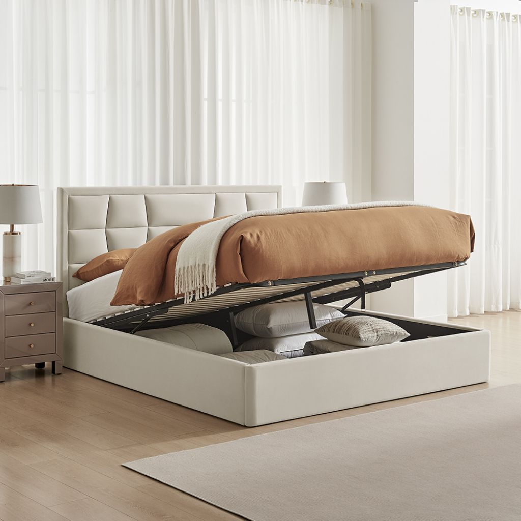 Beige upholstered bed with storage compartment in a modern bedroom setting.