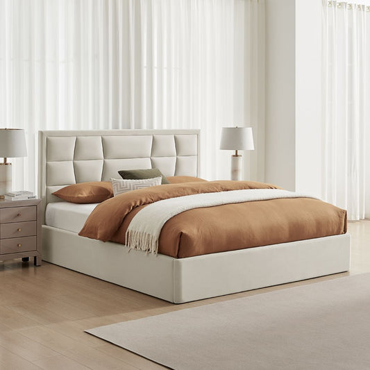 Beige upholstered bed with brown bedding in a bedroom setting.