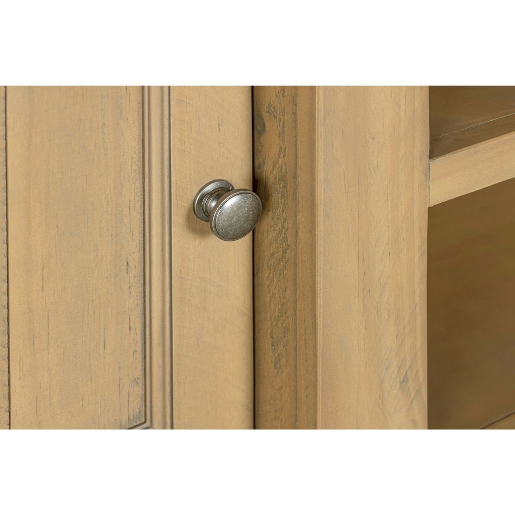 Close-up of a wooden cabinet with a metal handle on a white background