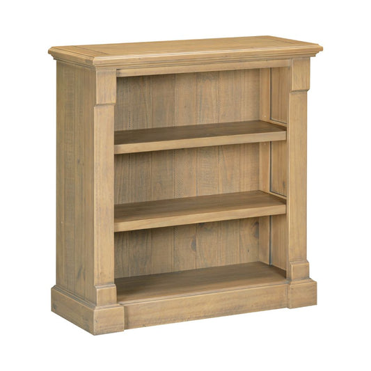 Wooden bookshelf with three shelves on a white background