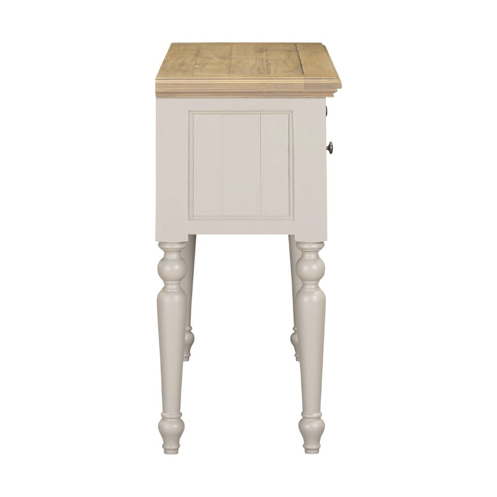 Small wooden side table with a light finish on a white background