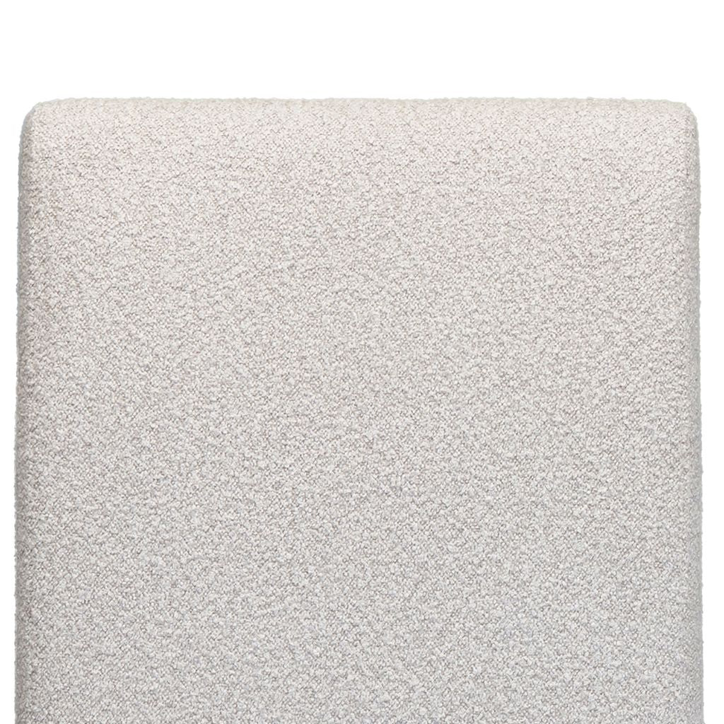 close up of the beautiful grey textured fabric used on the chateau dining chair